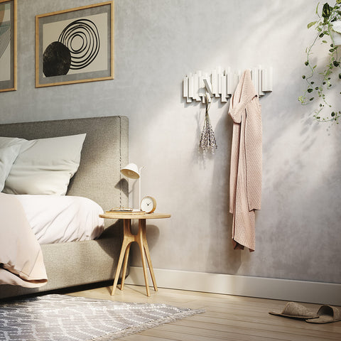 Umbra Sticks recycled plastic label emphasizing eco-friendly material benefit