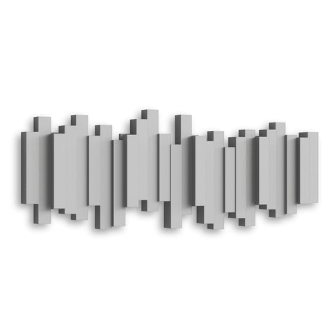 Umbra Sticks styled on a living room wall as decorative organizer blending form and function