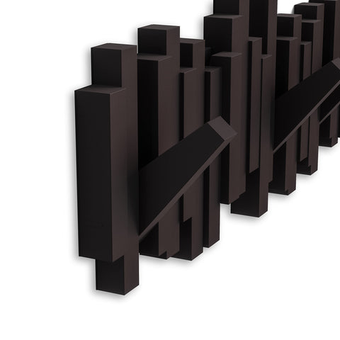 Umbra Sticks holding coats and bags to illustrate everyday organization