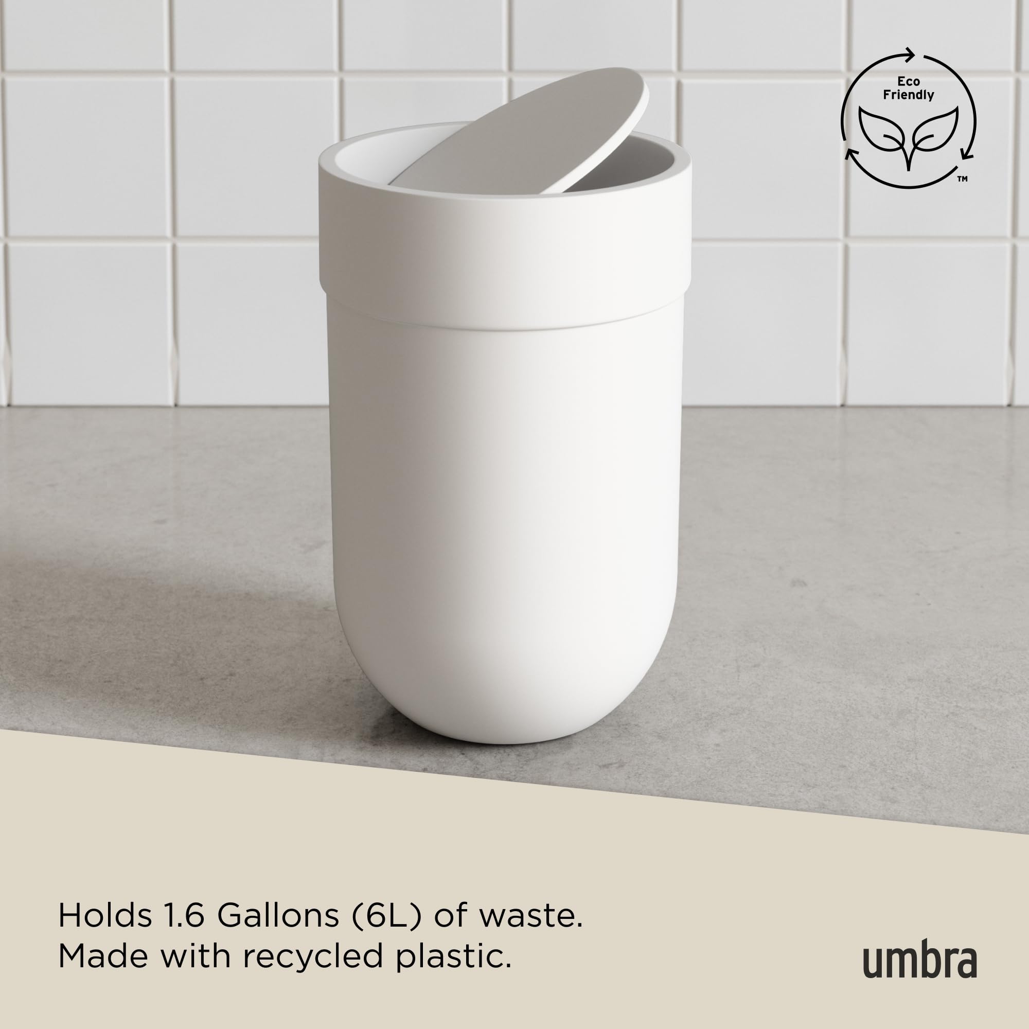 Umbra Touch beside toilet showing compact footprint benefit saves space