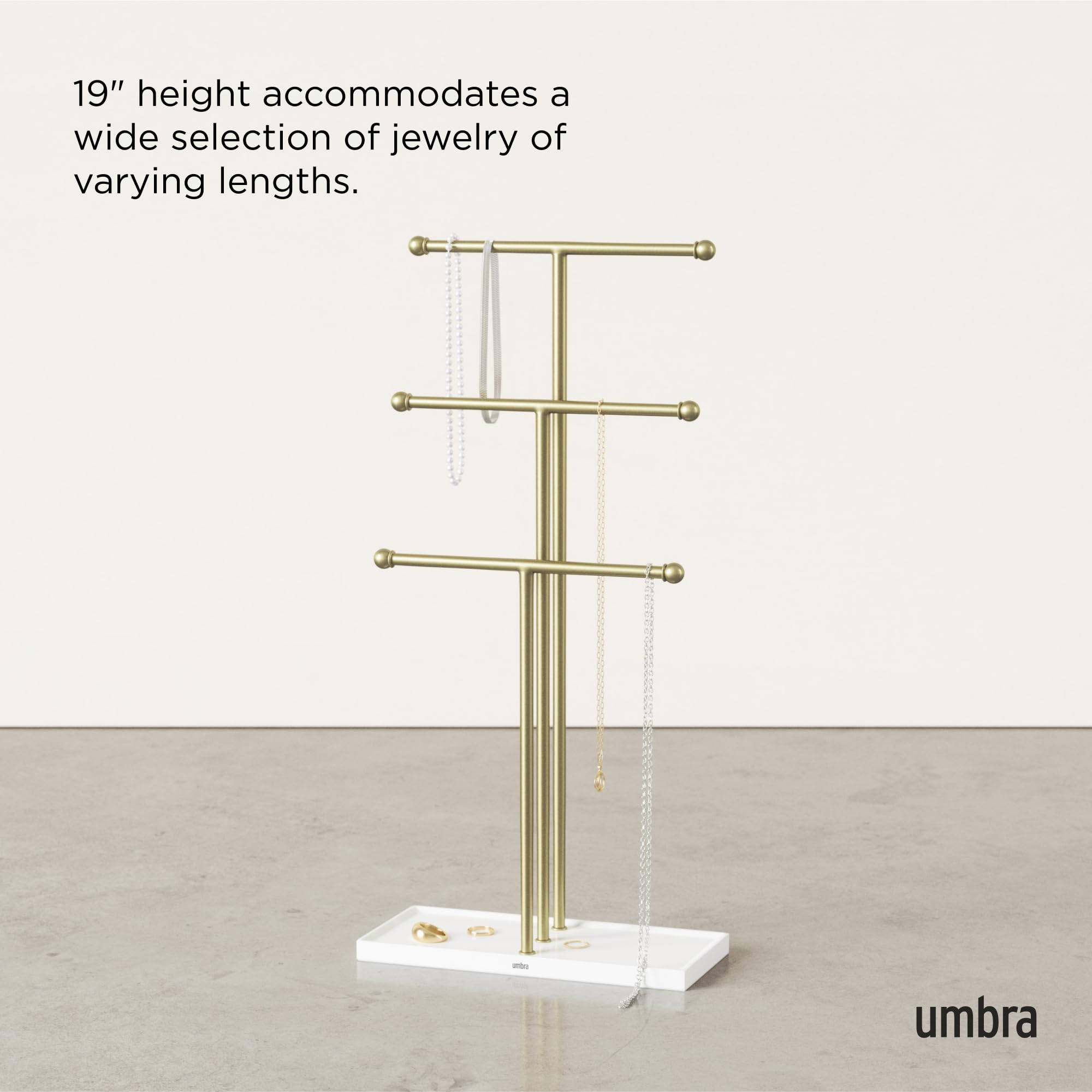 Umbra Trigem beside watch and sunglasses to show size and scale on dresser