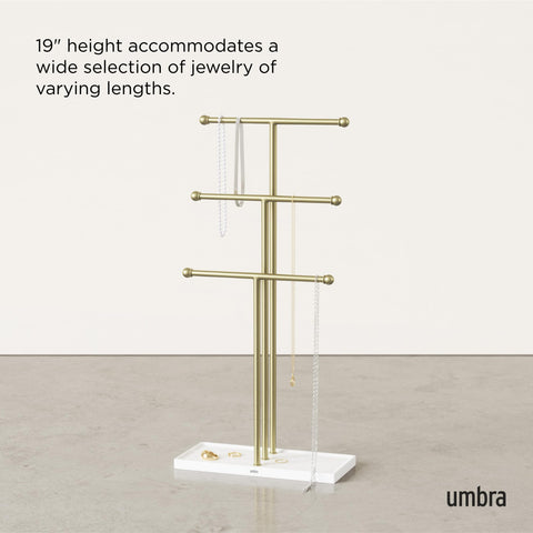 Umbra Trigem beside watch and sunglasses to show size and scale on dresser