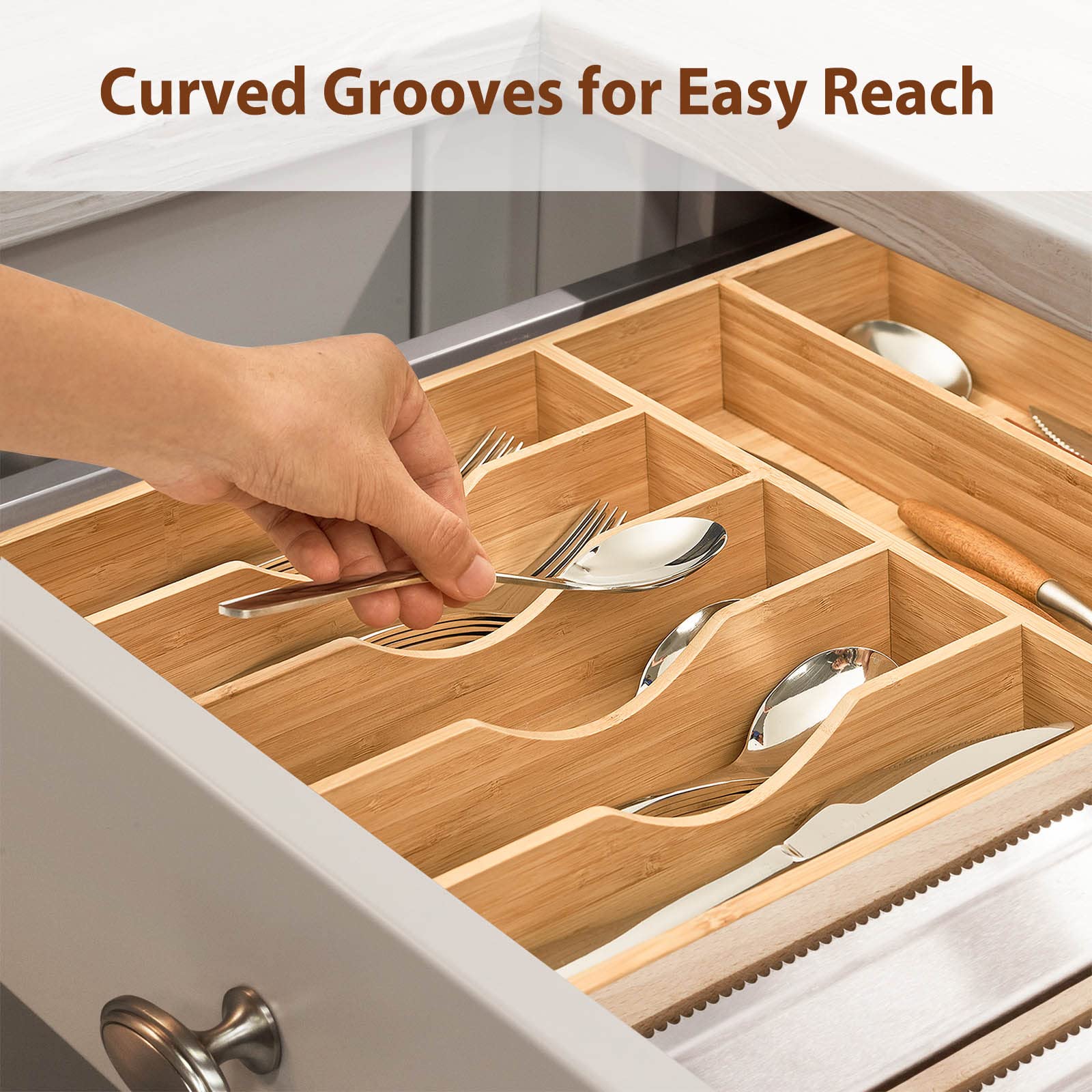 Umilife next to utensils to show scale and how larger tools fit benefit