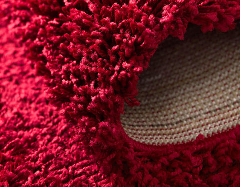 Unique Loom beside sofa showing scale and living-room styling benefit