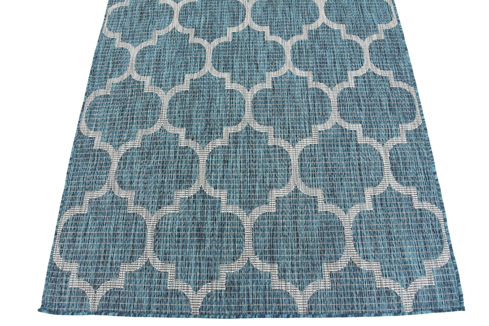 Unique Loom placed under table demonstrating stain resistance and easy care