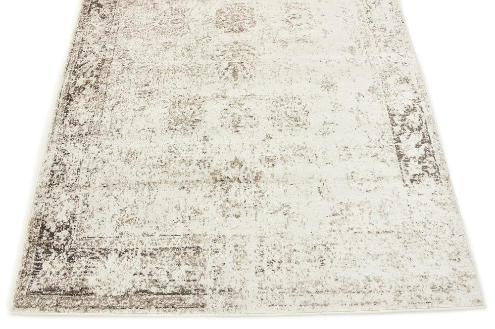 Unique Loom Sofia texture under sofa demonstrating low profile stability