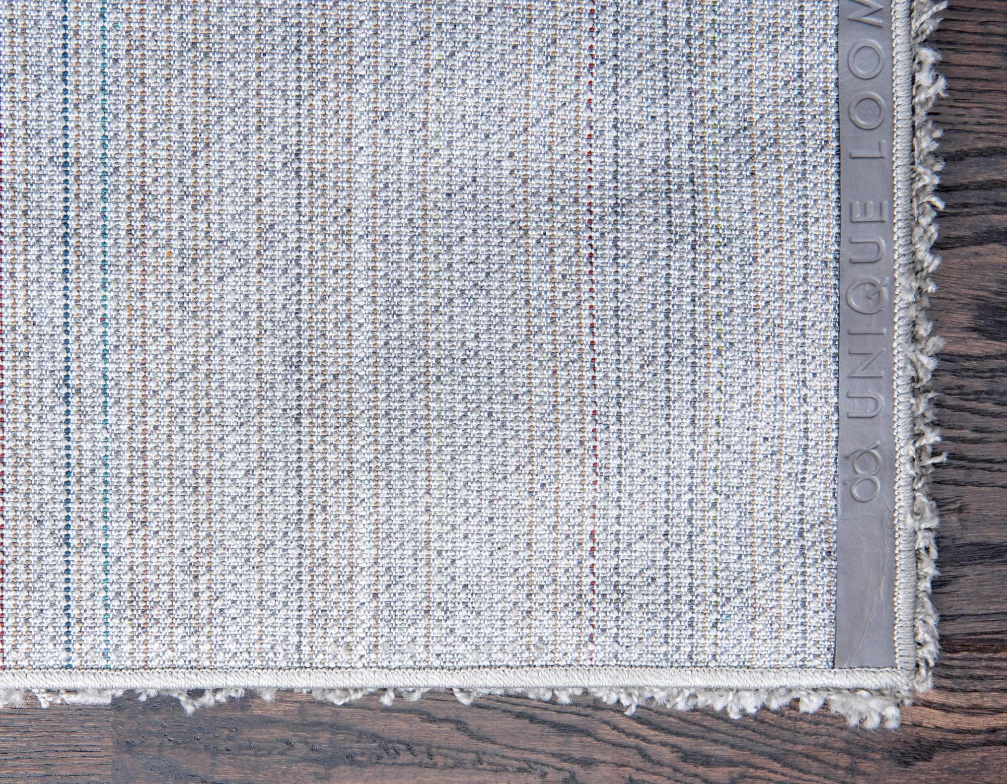 Unique Loom hand pressing pile to show texture and cushioned support