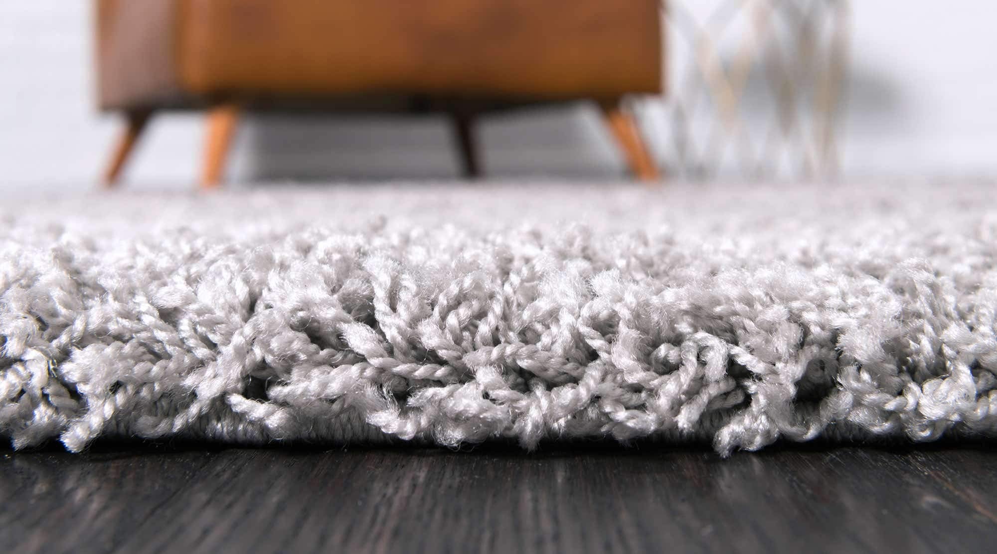 Unique Loom rug under bed demonstrating cozy bedroom styling and warmth
