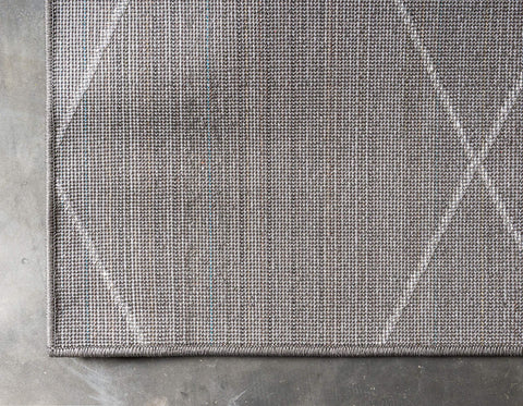 Unique Loom rolled packaging shot showing compact shipping and easy unrolling