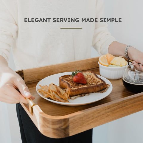 Upper tray holding charcuterie and glasses to showcase entertaining versatility
