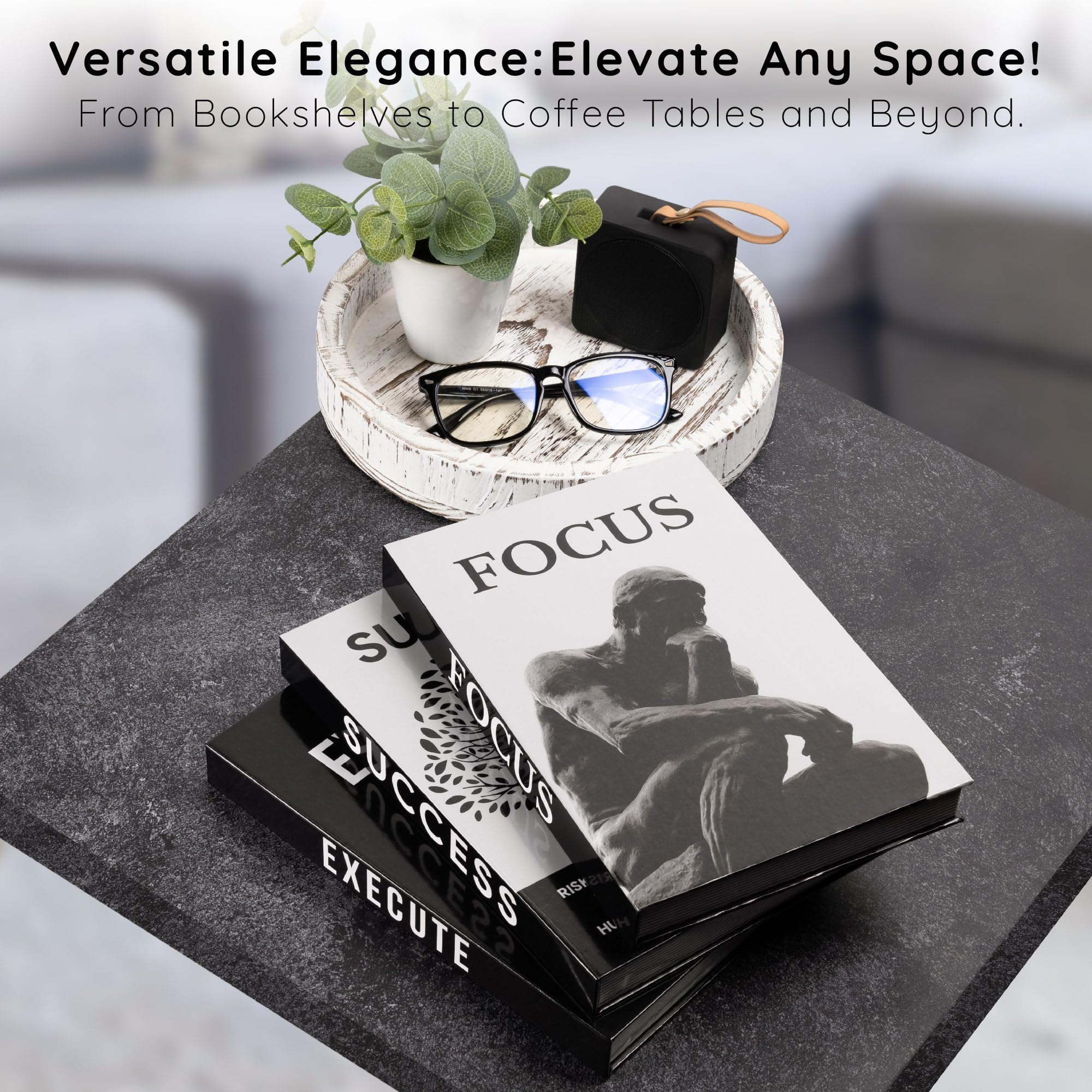 Upstart Decor stacked books on coffee table used as a base for decor creating layered styling benefit
