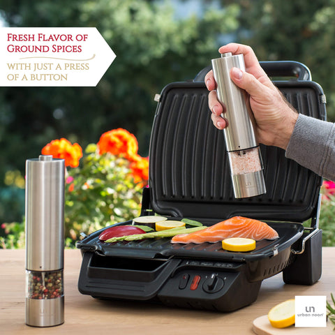 urban noon in hand demonstrating one-handed push-button grinding convenience