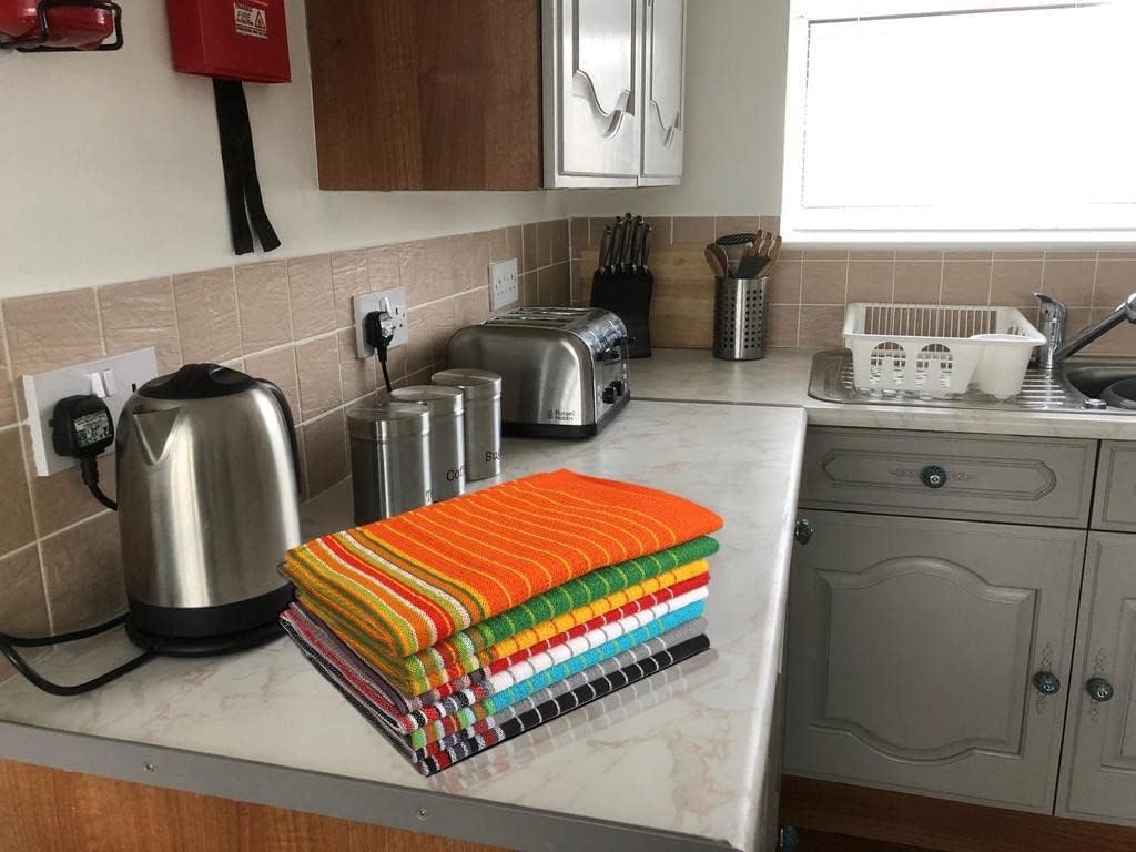 Urban Villa towels styled on kitchen counter showing coordinated decor impact