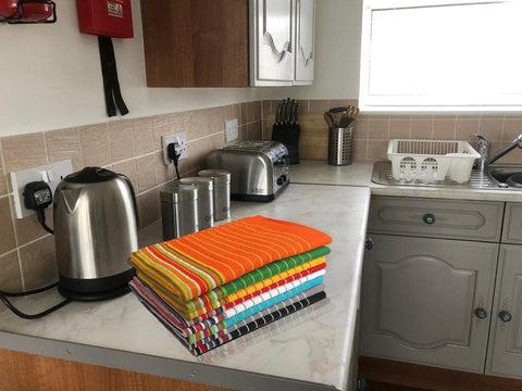 Urban Villa towels styled on kitchen counter showing coordinated decor impact