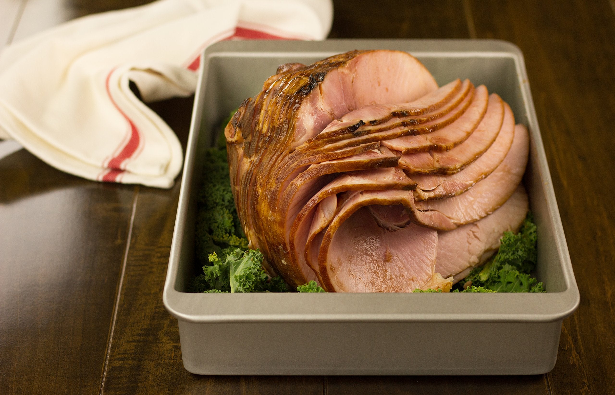 USA Pan in oven roasting chicken evenly with deep sides for juices and browning