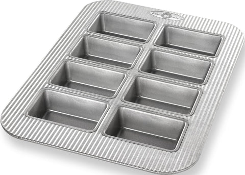 USA Pan front view of 8-well mini loaf pan showing even wells and durable finish for reliable baking