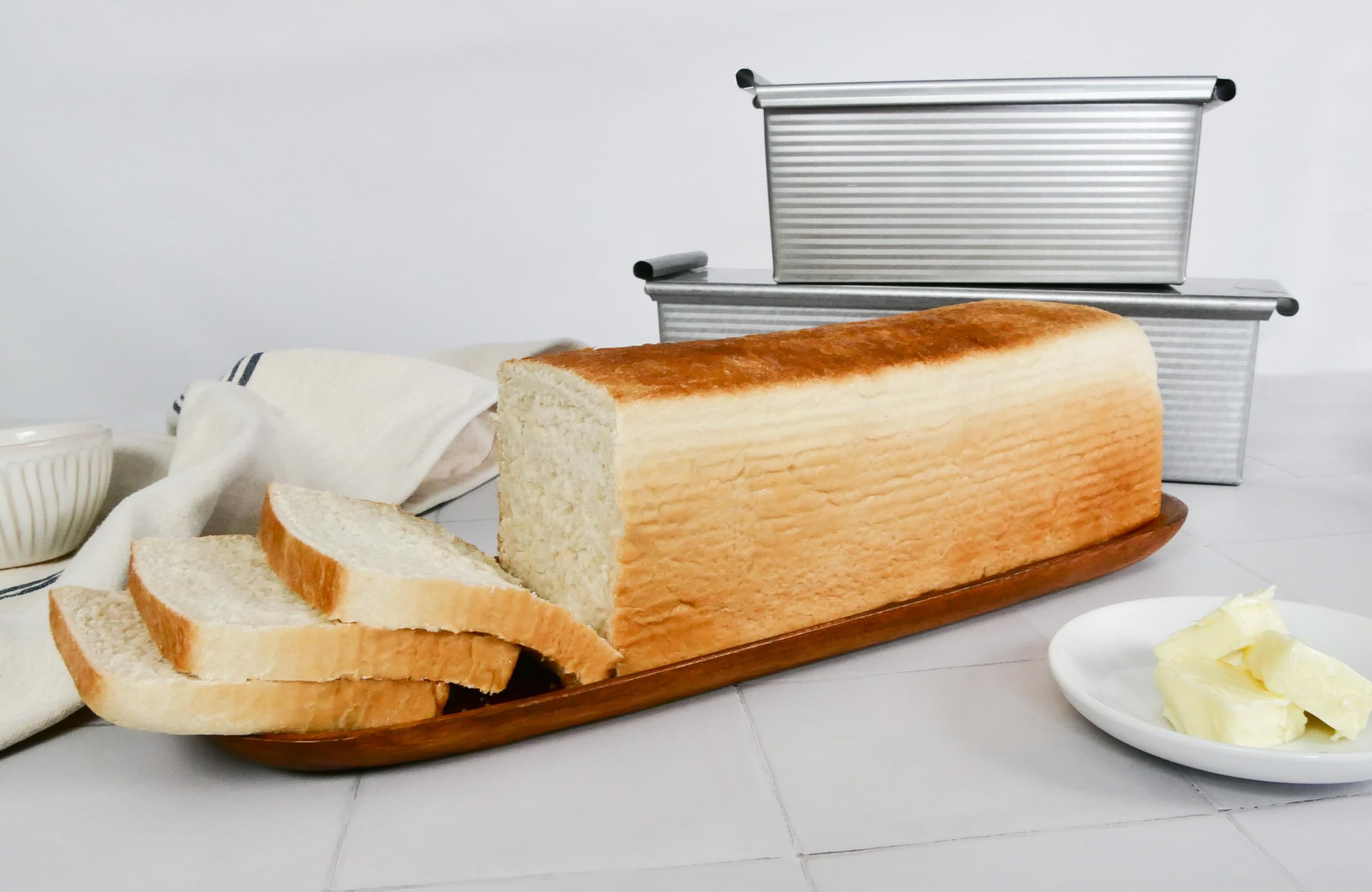 USA Pan loaf sliced on cutting board for sandwiches showing consistent slices