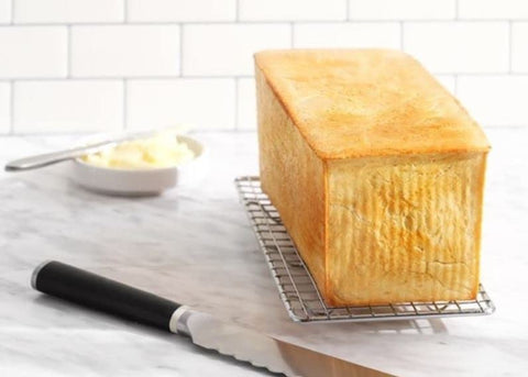 USA Pan loaf pan holding finished square loaf demonstrating even crust and consistent crumb