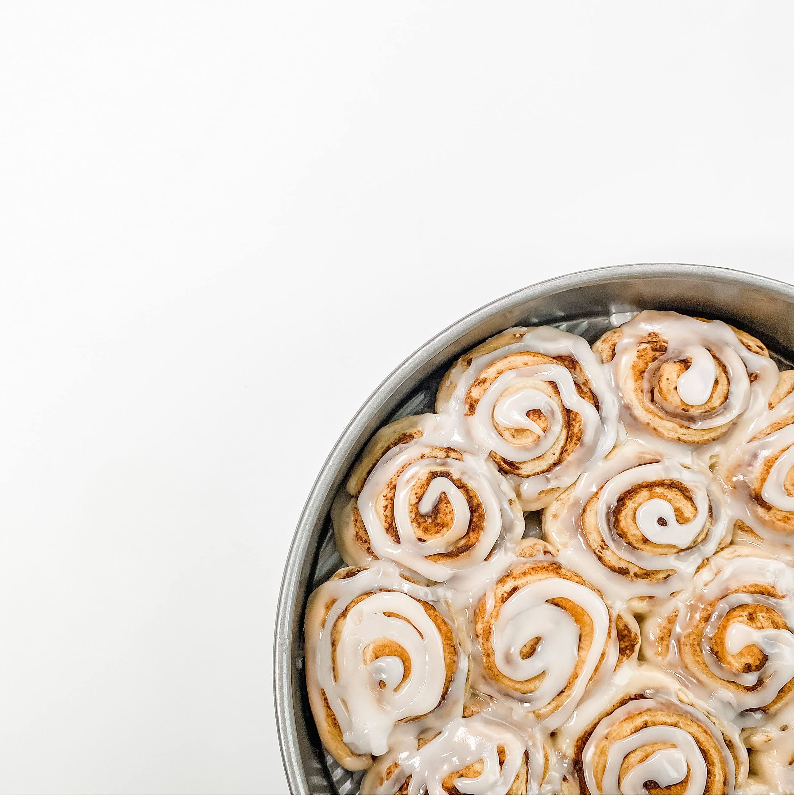 USA Pan in kitchen lifestyle with cake and tools illustrating reliable home baking