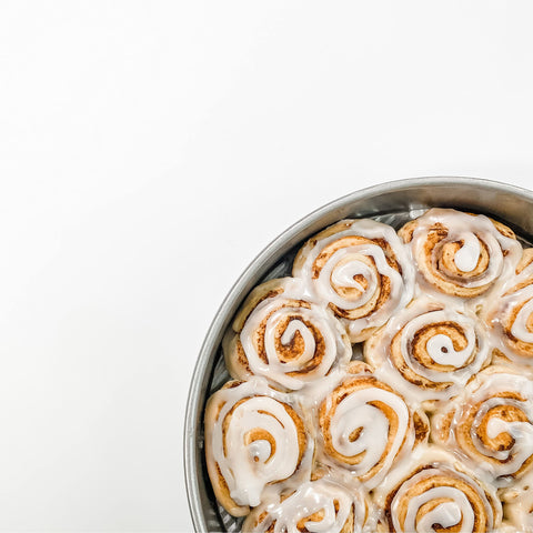 USA Pan in kitchen lifestyle with cake and tools illustrating reliable home baking