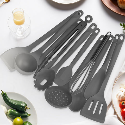 USECANO utensils beside a standard dinner plate illustrating scale and comfortable handling