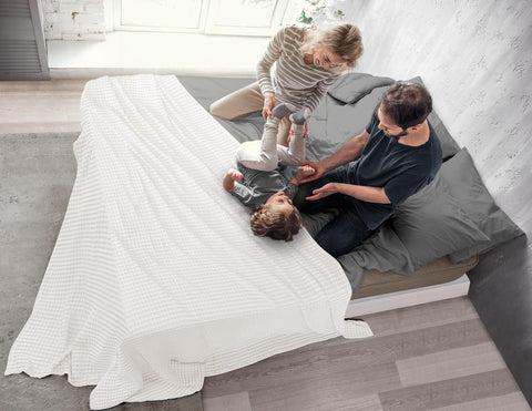 Utopia Bedding folded on a sofa to show compact storage and everyday convenience