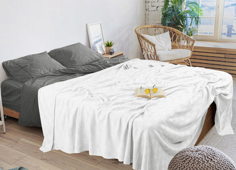Utopia Bedding draped at foot of bed adding layered styling and warmth