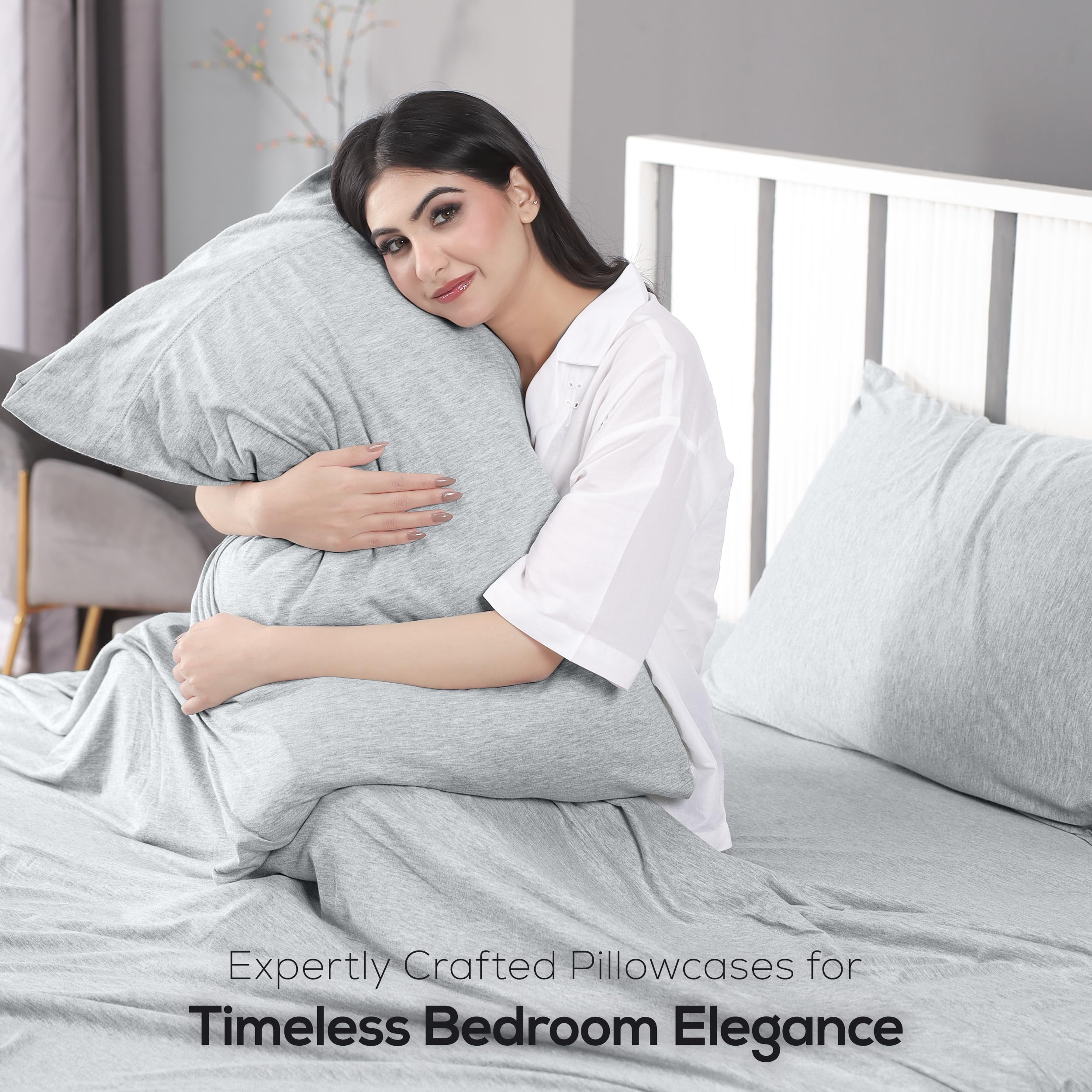 Utopia Bedding sheet stretched by hands demonstrating fabric elasticity and movement comfort benefit