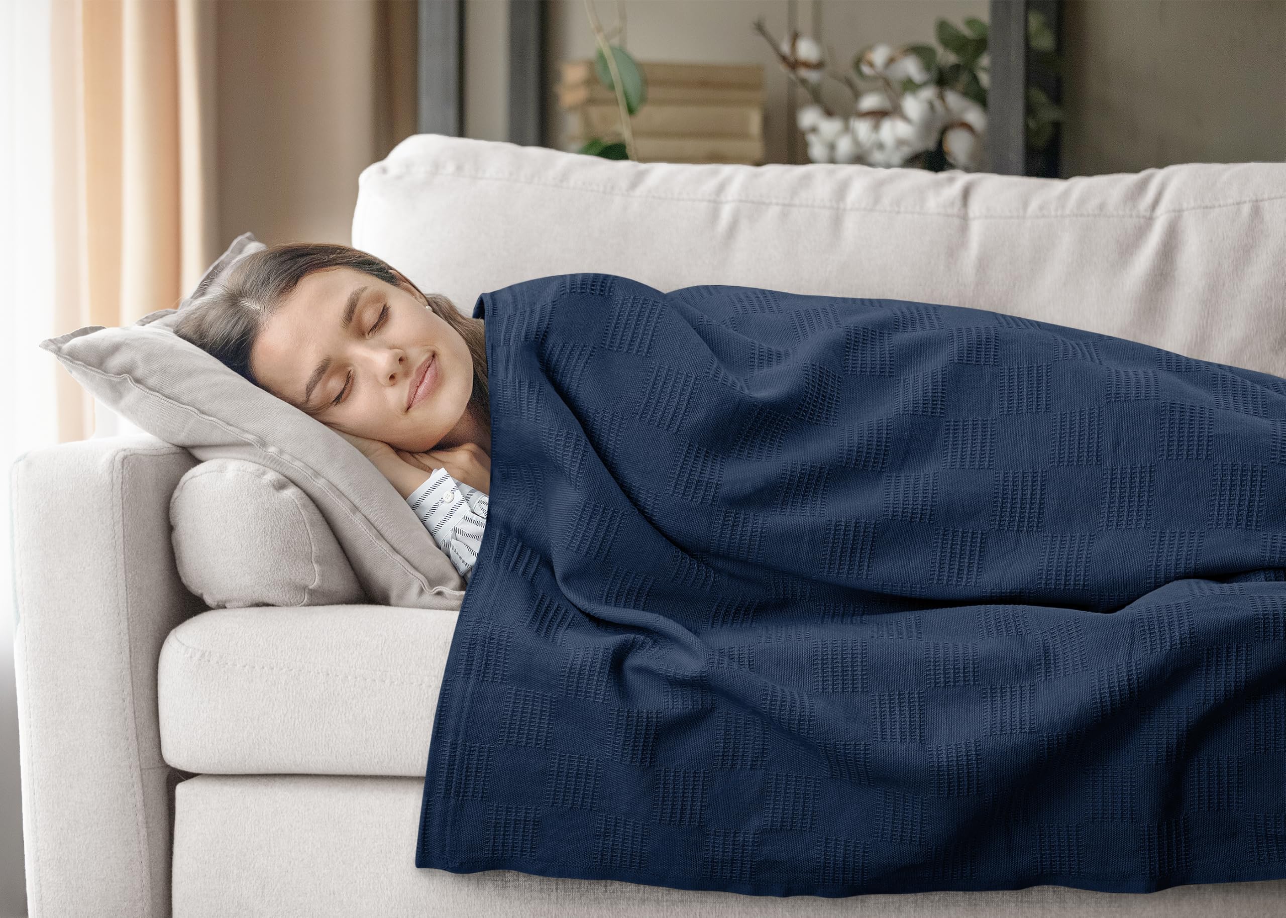 Utopia Bedding blanket draped on sofa in living room for cozy lifestyle appeal