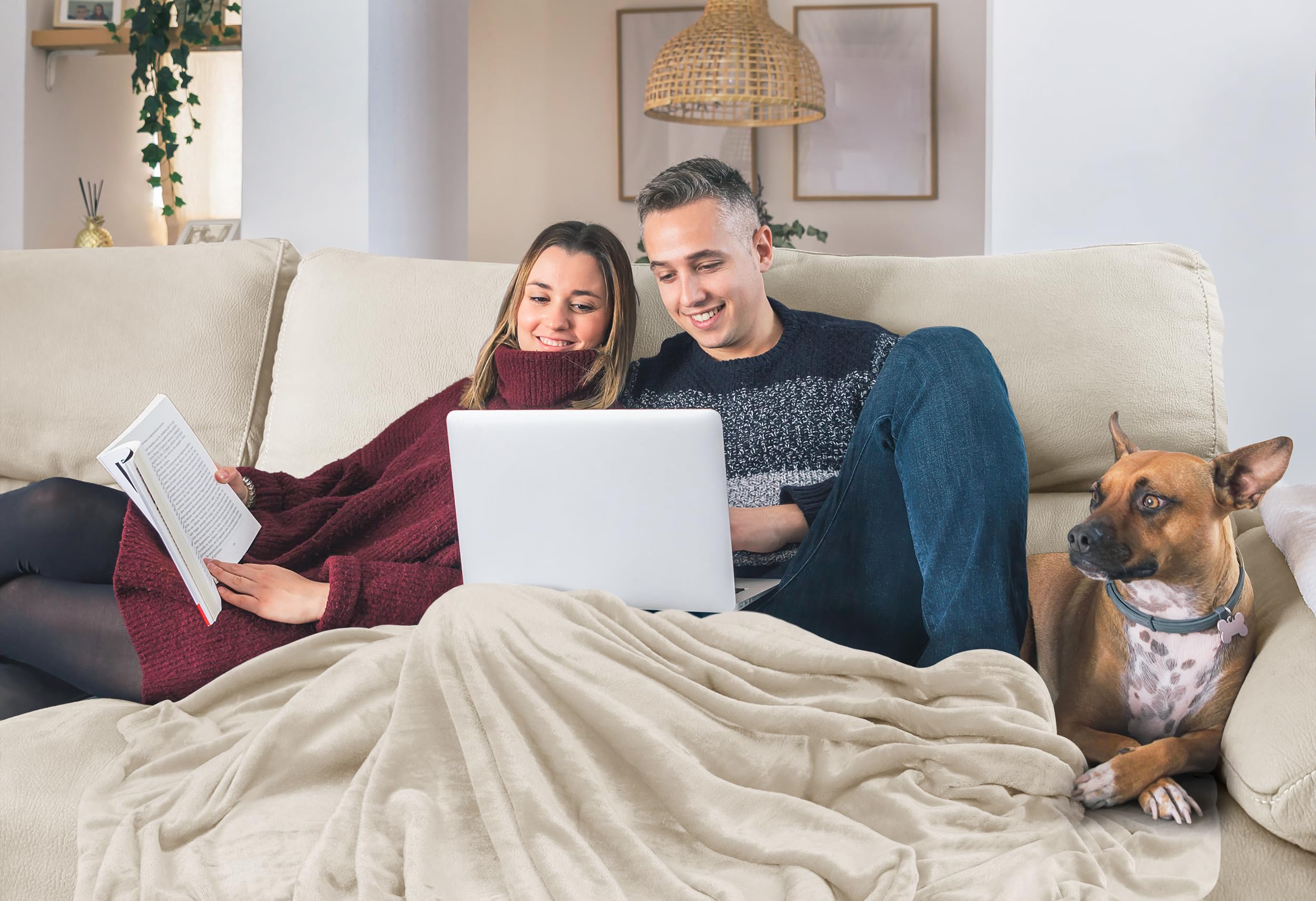 Utopia Bedding person wrapped in blanket on couch for comfortable lounging benefit