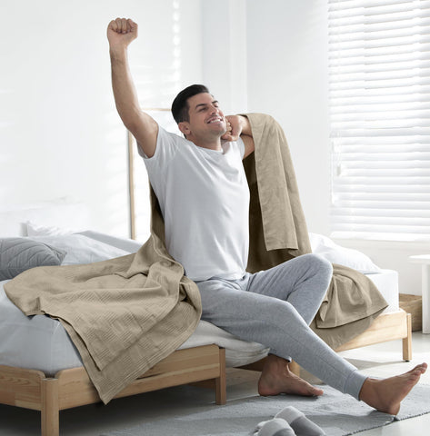 Utopia Bedding casually draped over sofa showing versatile use and cozy living-room appeal