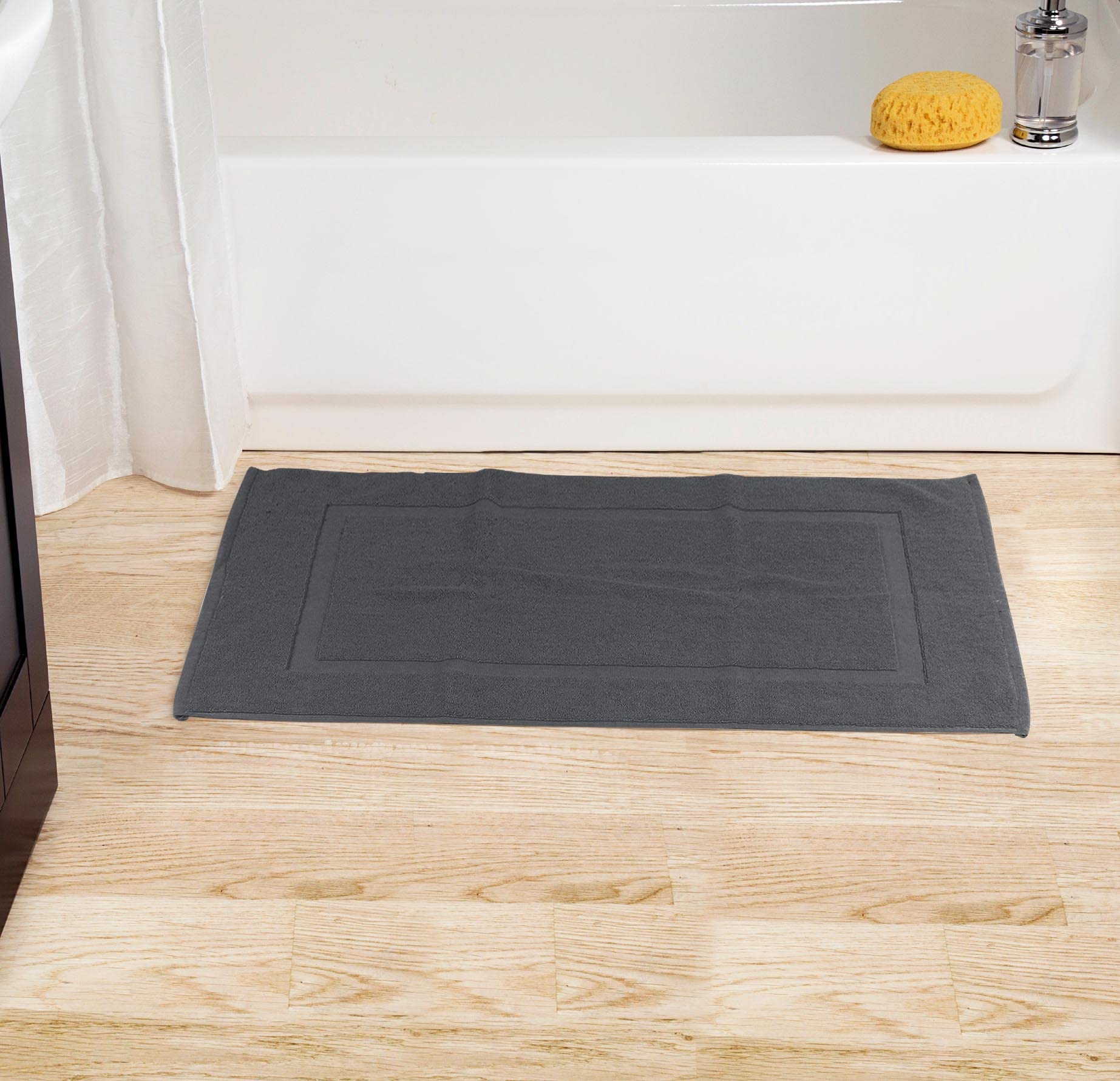 Utopia Towels styled in bathroom to show neutral grey coordinating with decor