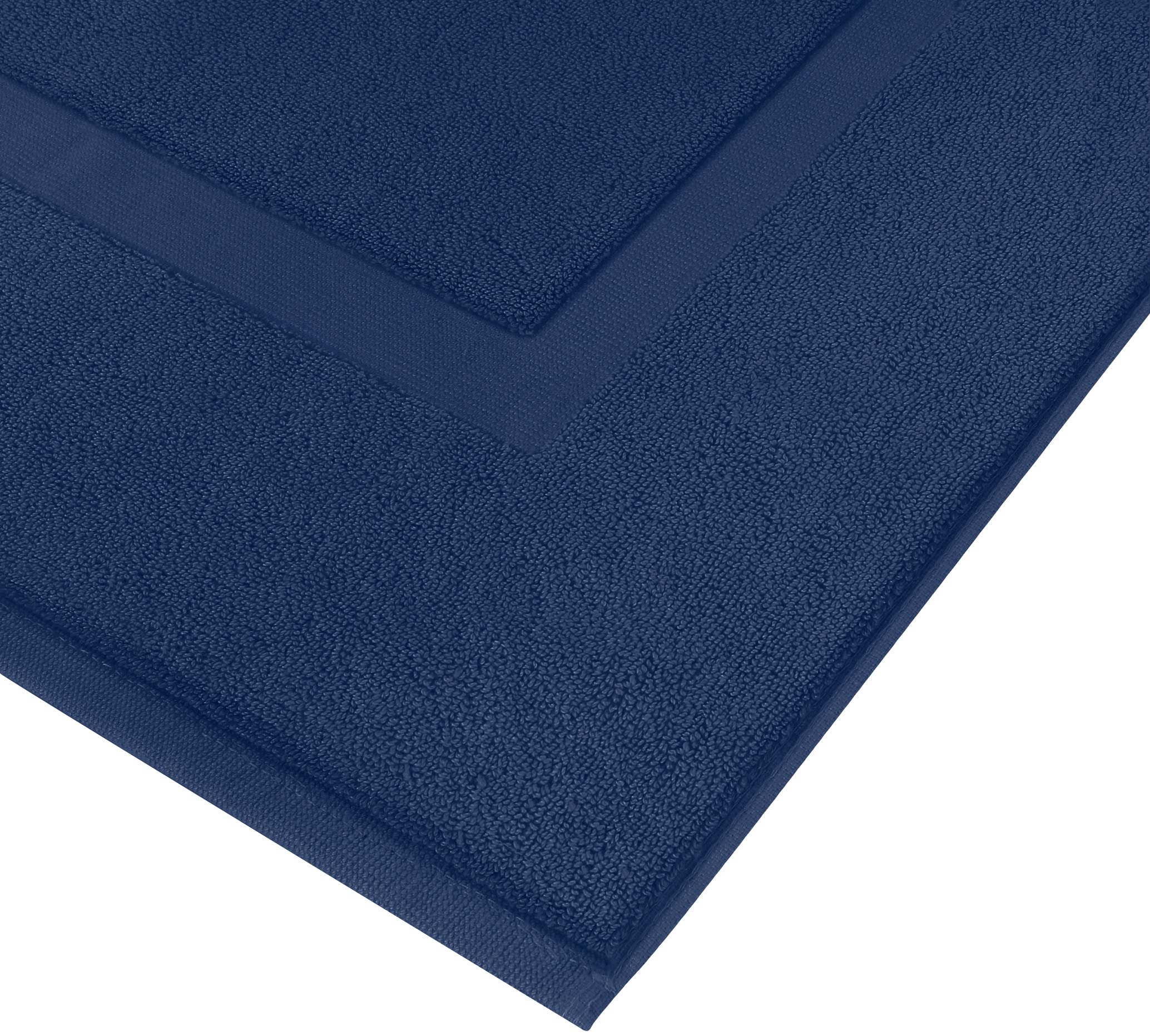 Utopia Towels navy mat styled in bathroom giving coordinated decor benefit
