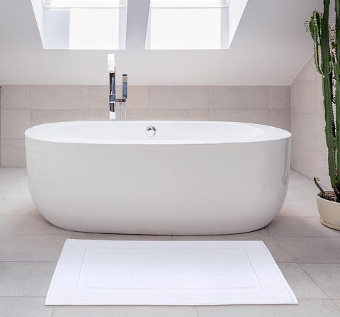 Utopia Towels mat styled with matching towels to illustrate coordinated bathroom look