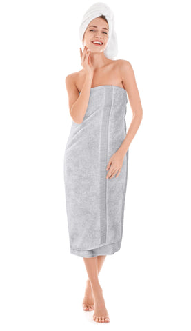 Utopia Towels folded on bathroom shelf showing neutral silver decor match