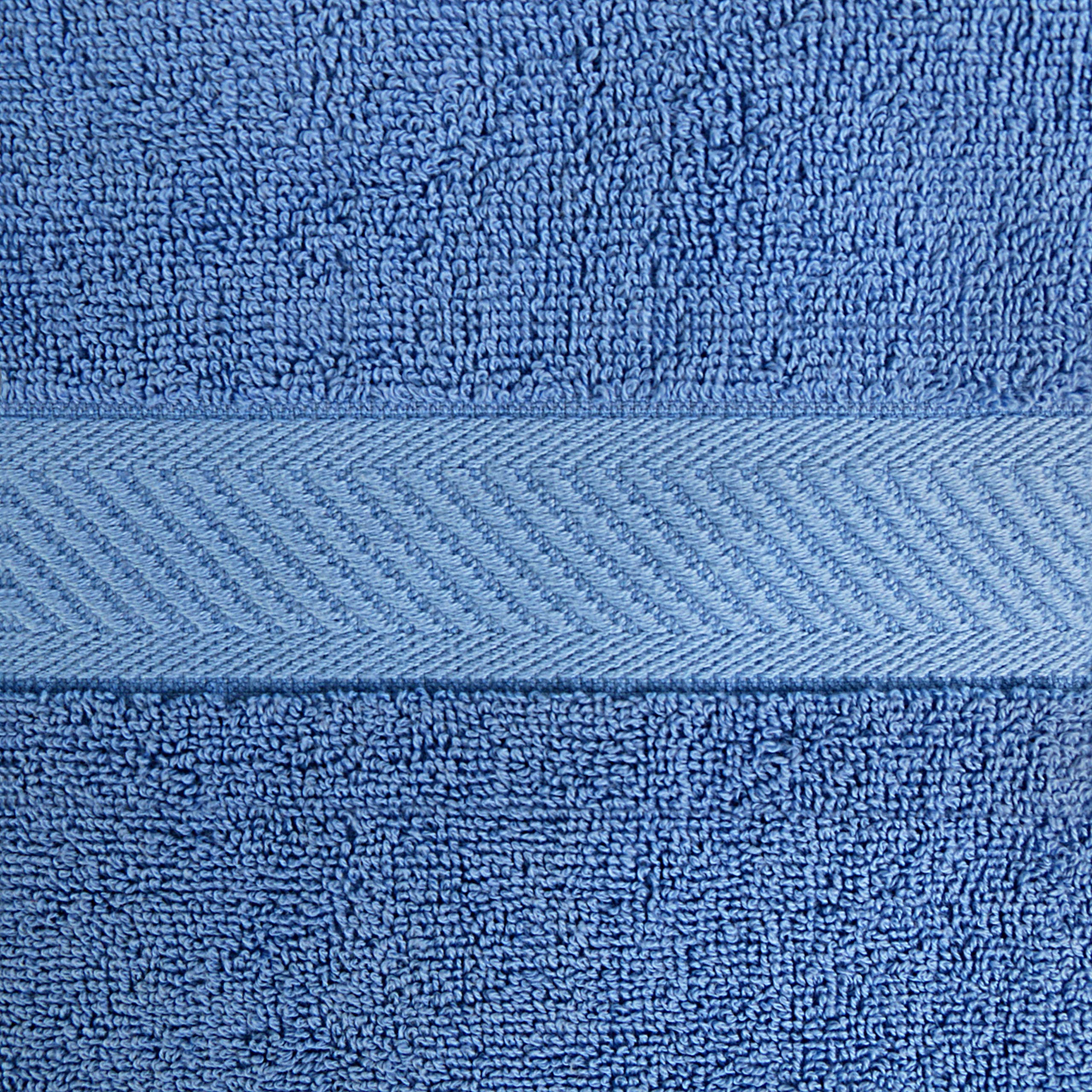 Utopia Towels styled in a bathroom highlighting durable hems and modern electric blue accent