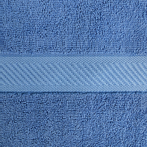 Utopia Towels styled in a bathroom highlighting durable hems and modern electric blue accent