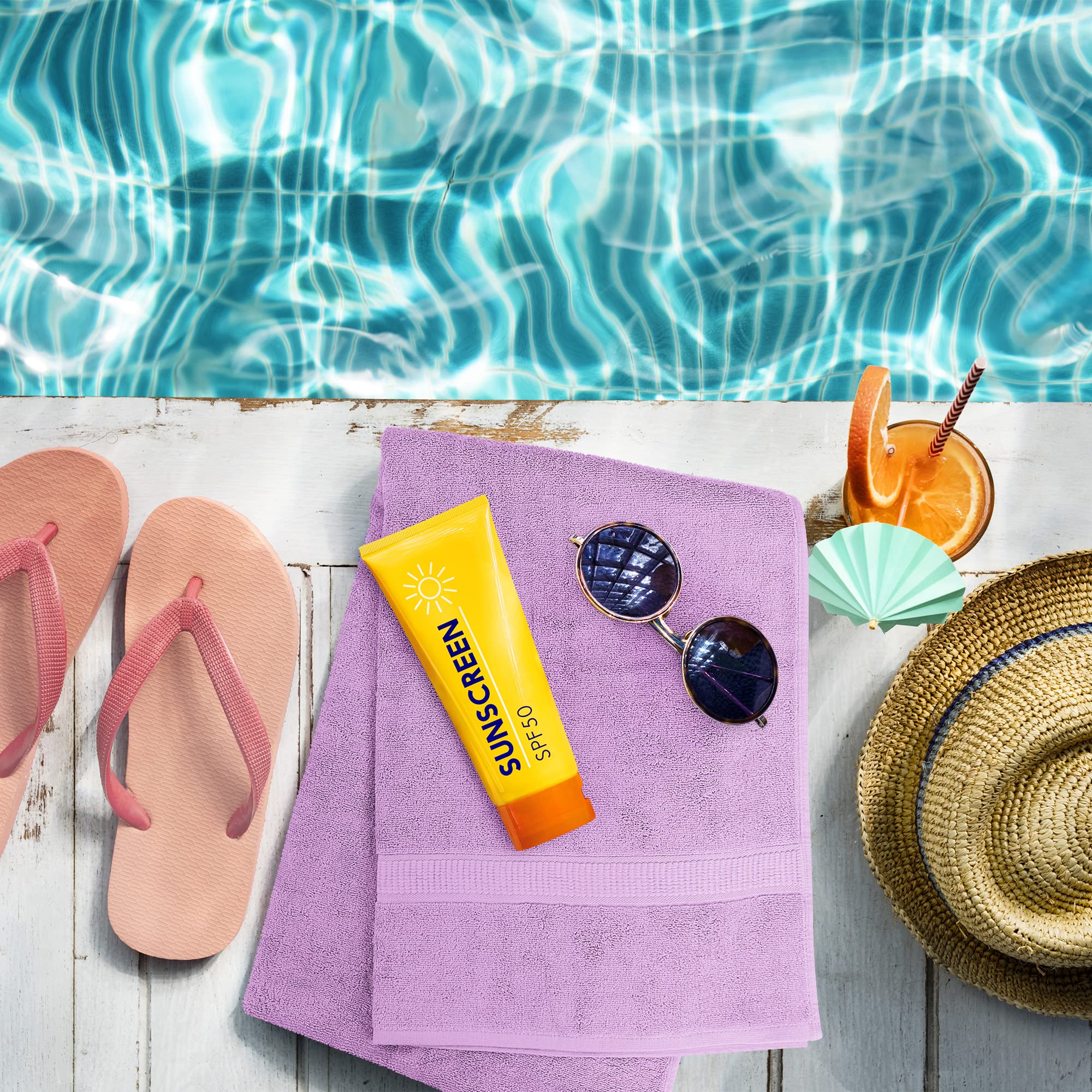 Utopia Towels lavender towels draped poolside, illustrating spa-like relaxation benefit