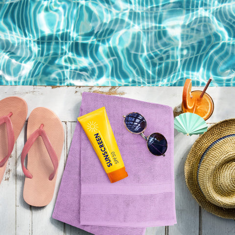 Utopia Towels lavender towels draped poolside, illustrating spa-like relaxation benefit