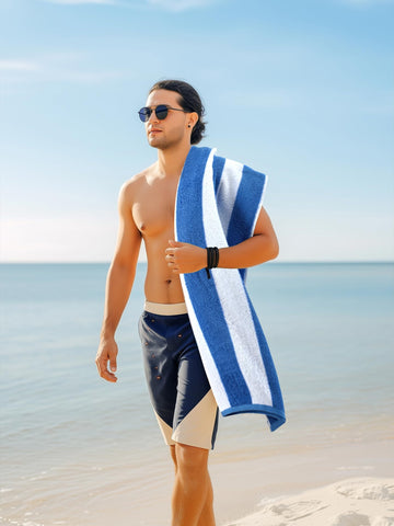 Utopia Towels draped over pool chair showing quick-dry, ready-to-use benefit