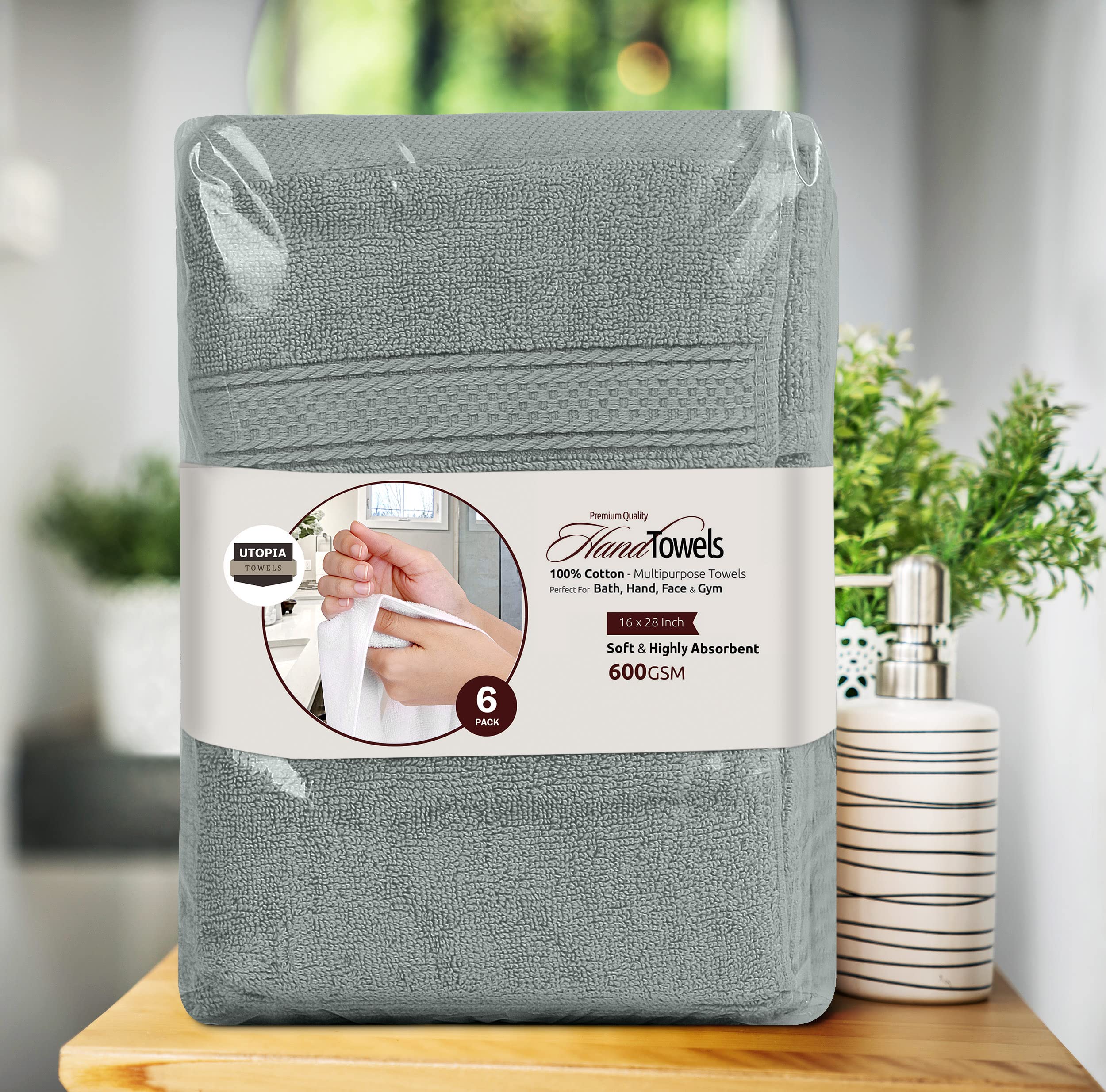 Utopia Towels care label close-up showing fiber content and washing guidance benefit