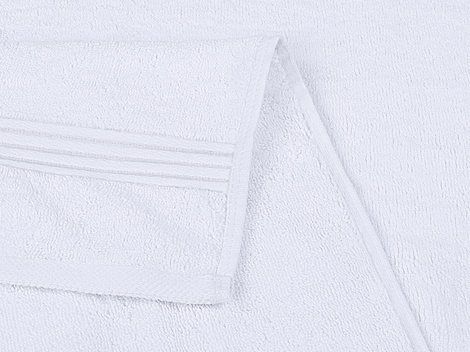Utopia Towels care label and material tag emphasizing 100% ring-spun cotton quality