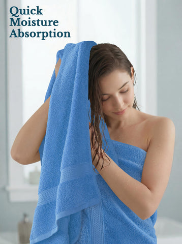Utopia Towels draped over bathtub showing stylish presentation and guest comfort