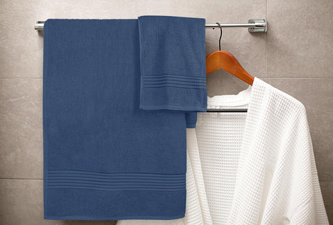 Utopia Towels neatly folded on shelf for organized bathroom storage