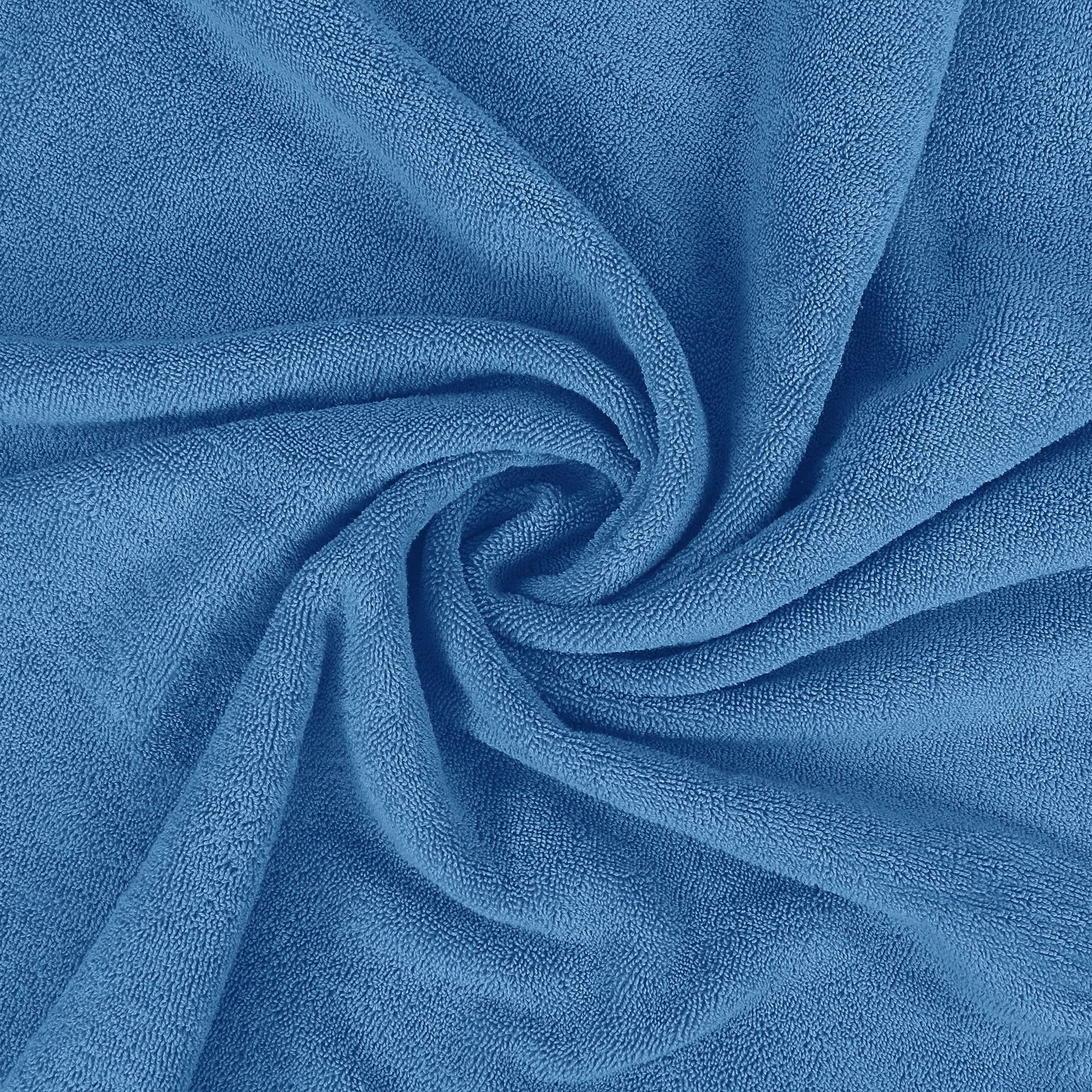 Utopia Towels folded stack on shelf showing tidy storage and vibrant electric blue