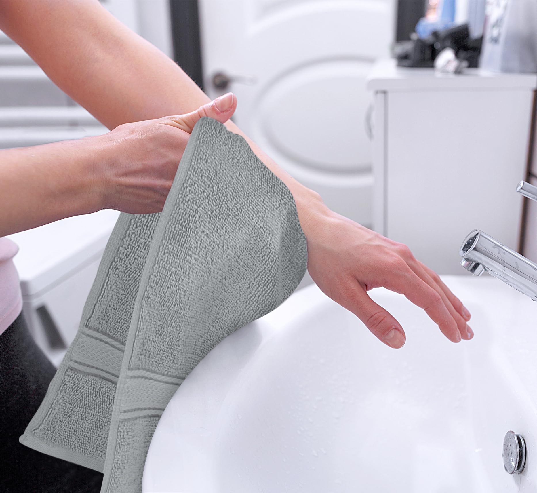 Utopia Towels folded stack in linen closet demonstrating space-saving and matching set