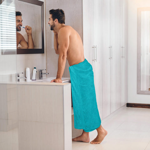 Utopia Towels folded stack in bathroom showing neat storage and styling benefit