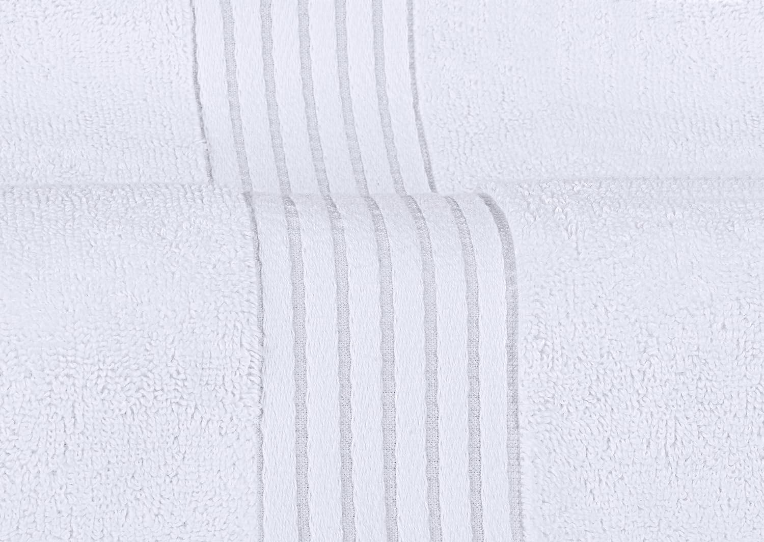 Utopia Towels hand towel stack beside sink conveying convenience and tidy look