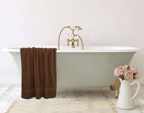 Utopia Towels fabric and care label showing 600 GSM ring-spun cotton benefit