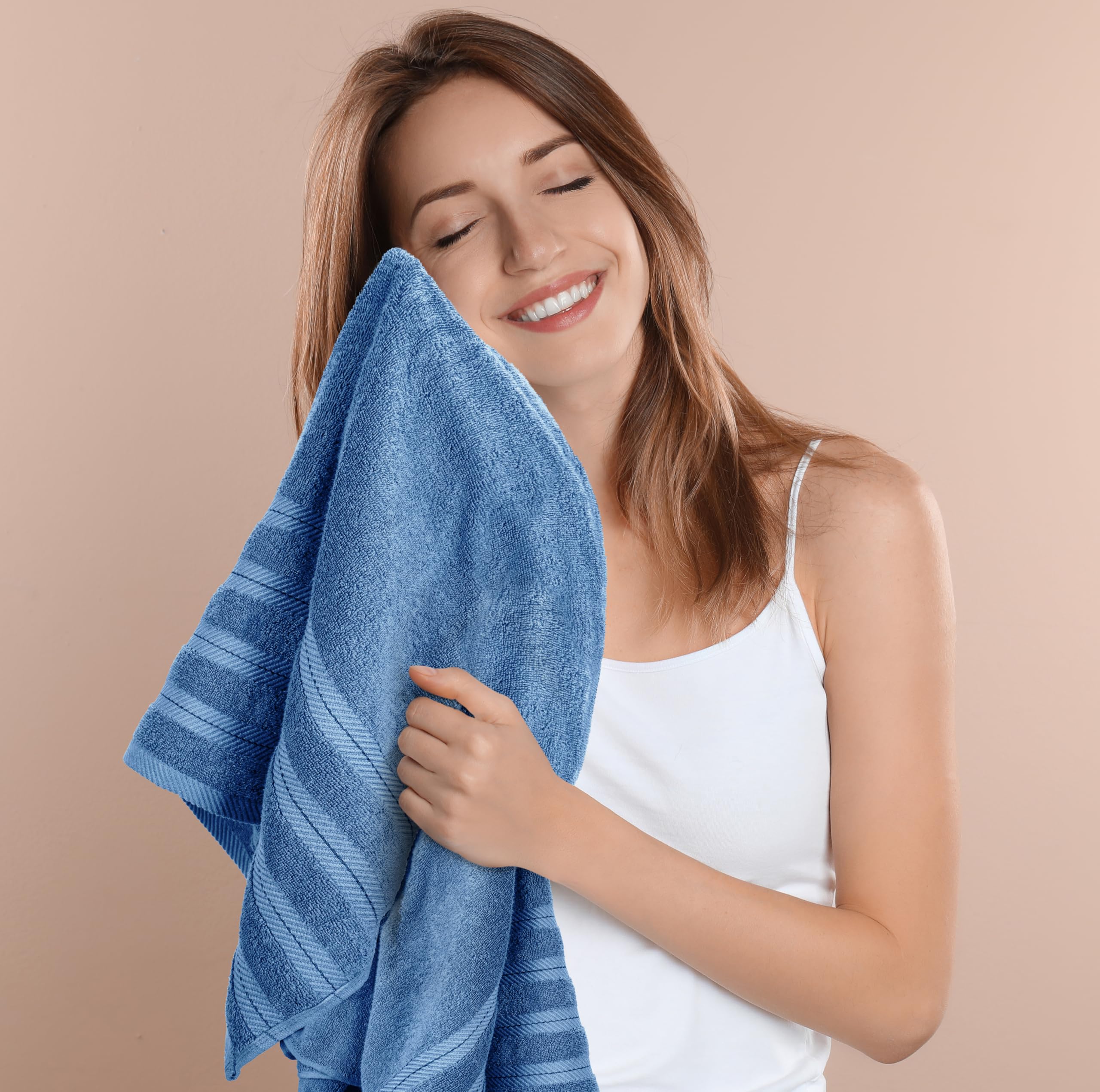 Utopia Towels draped over bathtub showing decorative and functional benefit